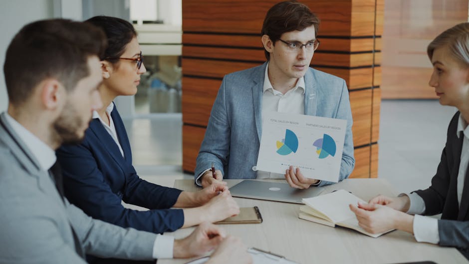 Auditor reviewing commercial invoices and cargo documents at a desk